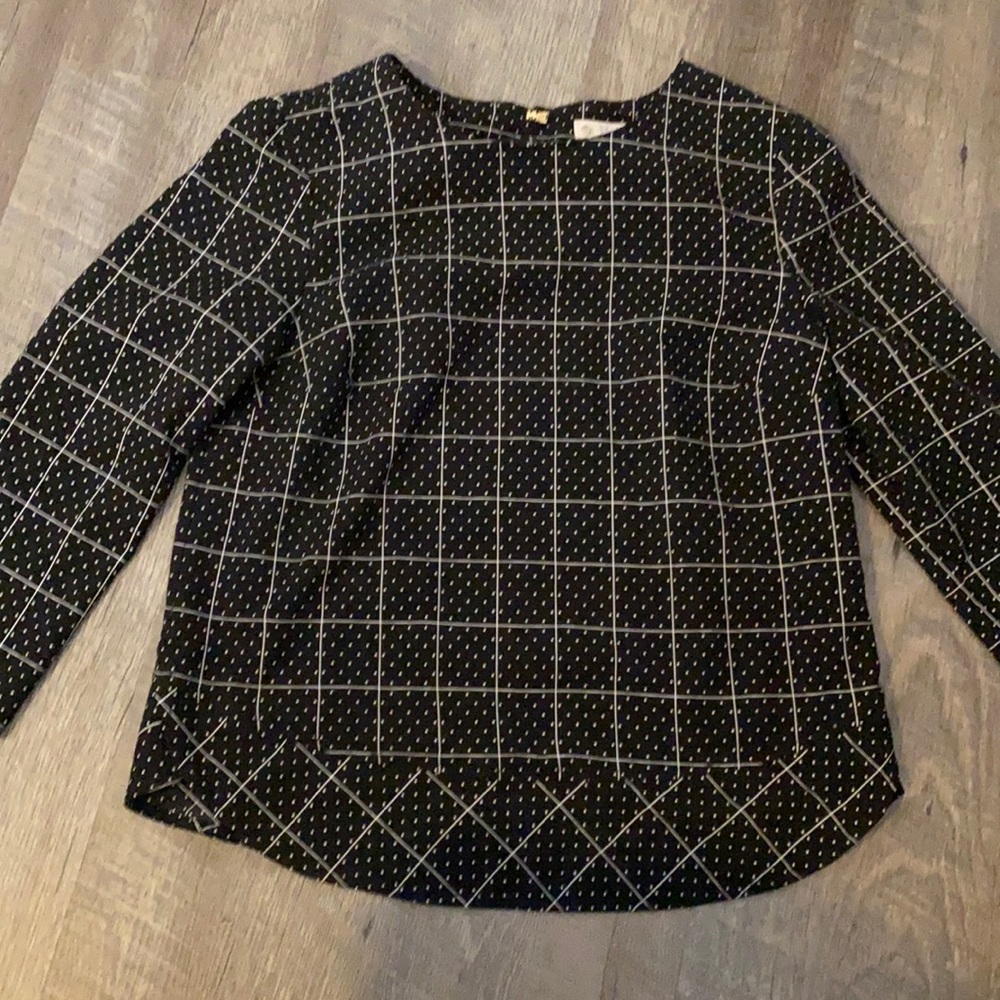 Black blouse with gold clasp closure in back